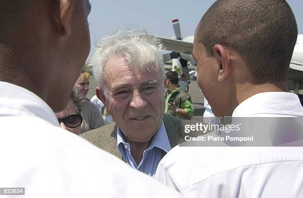 Former US House International Relations Committee Chairman Benjamin Gilman greets children as he arrives in Cartagena, Colombia February 17, 2001...