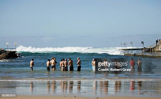 Swans players walk into the water at Clovelly Beach during the Sydney Swans AFL Recovery Session at Clovelly on August 17, 2008 in Sydney, Australia.
