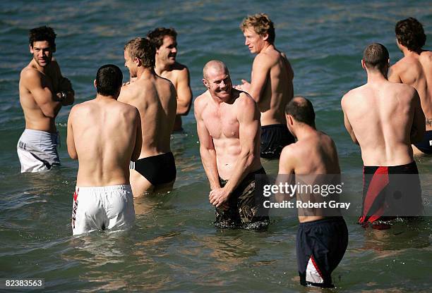 Barry Hall of the Swans and team mates walk into the water during the Sydney Swans AFL Recovery Session at Clovelly on August 17, 2008 in Sydney,...