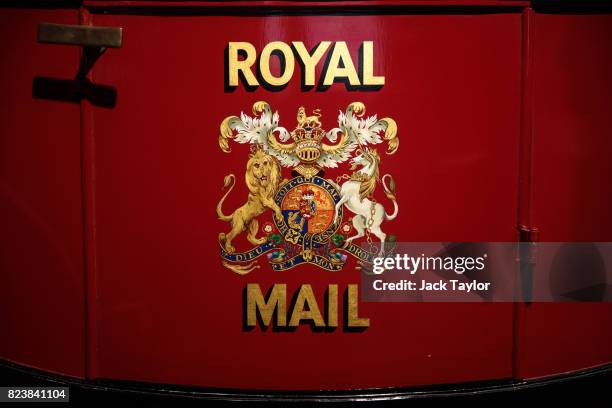 An old Royal Mail design sits on the side of a Mail Coach from around 1800 on display at the Postal Museum on July 28, 2017 in London, England. The...