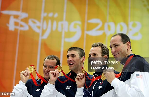 Brendan Hansen, Michael Phelps, Aaron Piersol and Jason Lezak of the United States hold their gold medals in the Men's 4x100 Medley Relay at the...