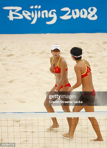 Jie Wang and Jia Tian of China react during their match against Austria in the beach volleyball event held at the Chaoyang Park Beach Volleyball...