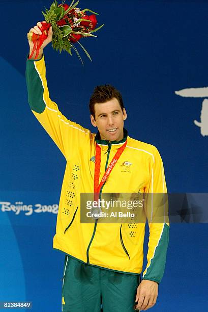 Grant Hackett of Australia celebrates his silver medal from the Men's 1500m Freestyle final held at the National Aquatics Centre during Day 9 of the...