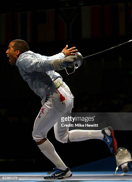Keeth Smart of the United States celebrates his team sabre fencing semifinal win over Russia at the Fencing Hall of National Convention Center on Day...