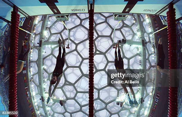 Ryan Cochrane of Canada and Grant Hackett of Australia compete in the Men's 1500m Freestyle at the National Aquatics Centre during Day 9 of the...