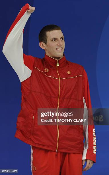 Bronze medalist Canada's Ryan Cochrane stands on the podium after the men's 1500m freestyle swimming final medal ceremony at the National Aquatics...