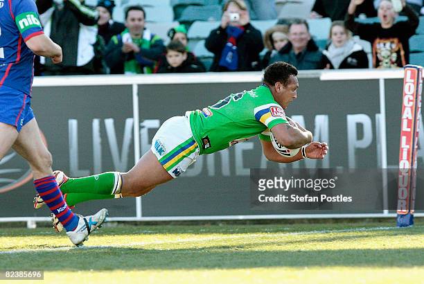 Neville Costigan of the Raiders scores a try during the round 23 NRL match between the Canberra Raiders and the Newcastle Knights at Canberra Stadium...