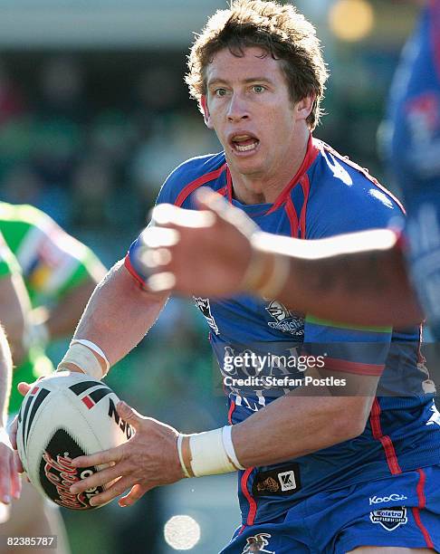 Kurt Gidley of the Knights looks to off load during the round 23 NRL match between the Canberra Raiders and the Newcastle Knights at Canberra Stadium...