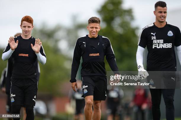 Jack Colback Dwight Gayle and Karl Darlow walk on the pitch during the Newcastle United Training session at the Newcastle United Training ground on...
