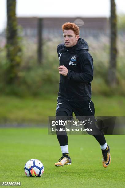 Jack Colback runs with the ball during the Newcastle United Training session at the Newcastle United Training ground on July 28 in Newcastle upon...