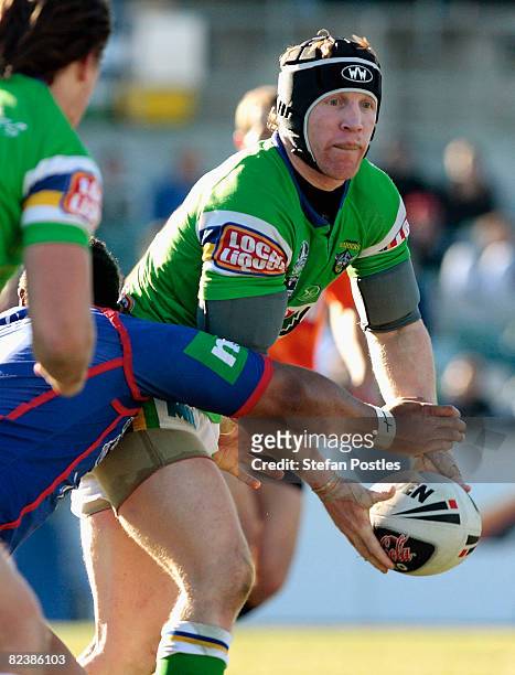Alan Tongue of the Raiders looks to pass the ball during the round 23 NRL match between the Canberra Raiders and the Newcastle Knights at Canberra...