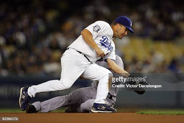Jeff Kent of the Los Angeles Dodgers makes the catch at second base but can't make the tag on the steal attempt by Ray Durham of the Milwaukee...
