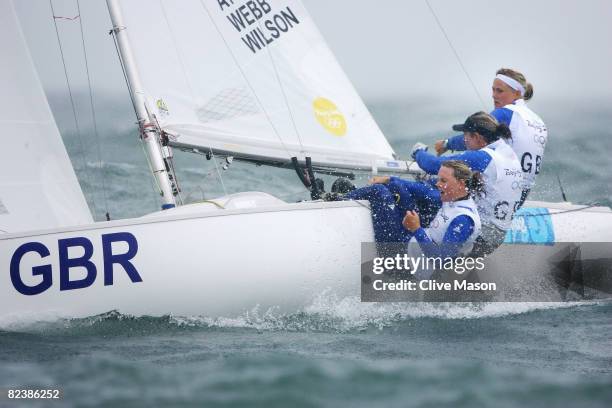 Pippa Wilson, Sarah Webb and Sarah Ayton of Great Britain compete on their way to overall victory in the Yngling class event held at the Qingdao...