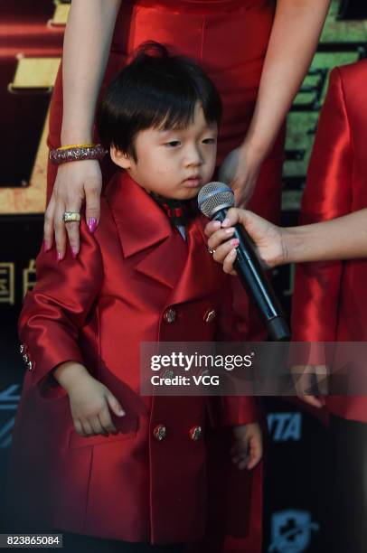 Boxer Zou Shiming's son Zou Minghao arrives at the red carpet of WBO Championship Defending Fight between Zou Shiming and Sho Kimura on July 28, 2017...