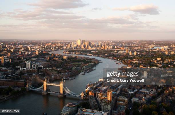 aerial view over city of london and river thames - london aerial stock pictures, royalty-free photos & images