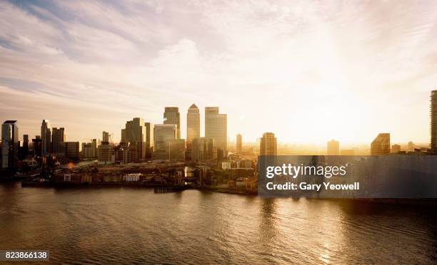 aerial view over canary wharf skyline in london - sunset on canary wharf stock pictures, royalty-free photos & images