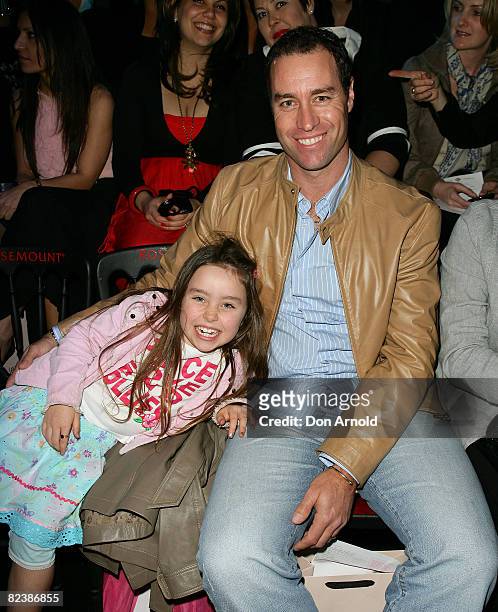 Michael Bevan and his daughter sit front row at Alex Perry's Ready to Wear bridal collection / Safari Princess Spring/Summer collection on the...
