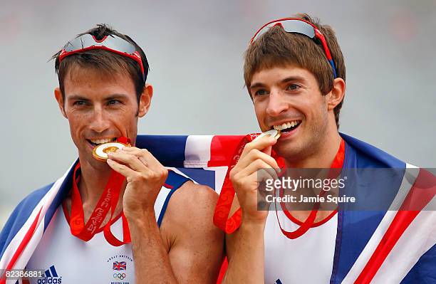 Mark Hunter and Zac Purchase of Great Britain celebrate their gold medal in Lightweight Men's Double Sculls Final at the Shunyi Olympic...
