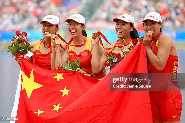 Tang Bin, Jin Ziwei, Xi Aihua and Zhang Yangyang of China celebrate their gold medal in the Women's Quadruple Sculls at the Shunyi Olympic...