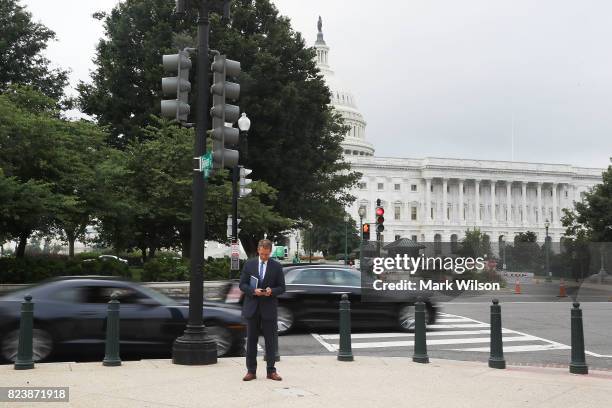 Sen. Jeff Flake stands near the US Capitol hours after voting on the GOP 'Skinny Repeal' health care bill, on July 28, 2017 in Washington, DC. Three...