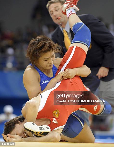 Japan's Kaori Icho fights with Russia's Alena Kartashova during the women's 63kg freestyle wrestling gold medal match at the 2008 Beijing Olympic...