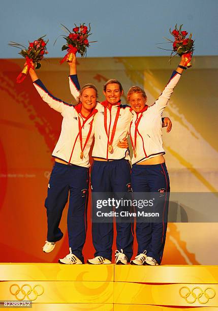 Pippa Wilson Sarah Webb and Sarah Ayton of Great Britain celebrate with their gold medals after winning the Yngling class event held at the Qingdao...