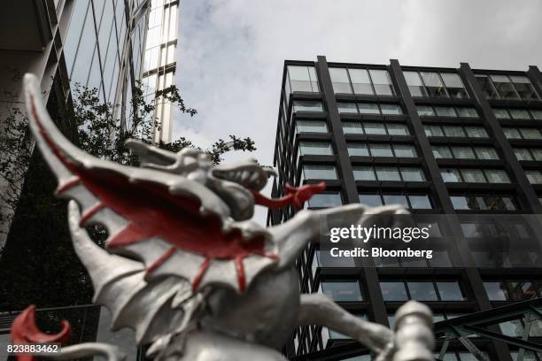 City of London Dragon' icon stands near the Amazon.com Inc. Offices at Principal Place in the City of London, U.K., on Friday, July 28, 2017. The...