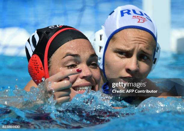 Canadian Christine Robinson vies with Tatian Tulkunova of Russia in 'Hajos Alfred' swimming pool in Budapest on July 28, 2017 during the women bronze...