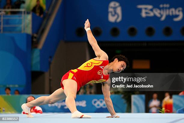 Zou Kai of China competes in the men's floor exercise final during the artistic gymnastics event held in National Indoor Stadium on Day 9 of the...