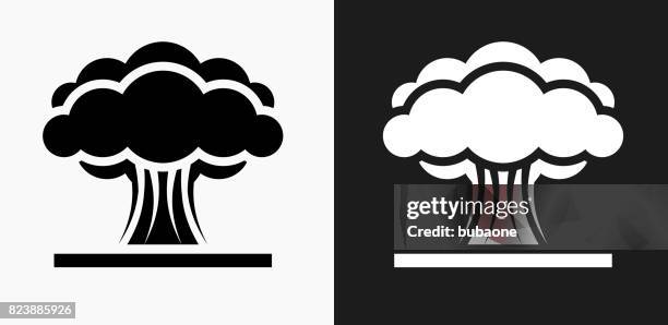 atomic explosion icon on black and white vector backgrounds - nuclear explosion icon stock illustrations
