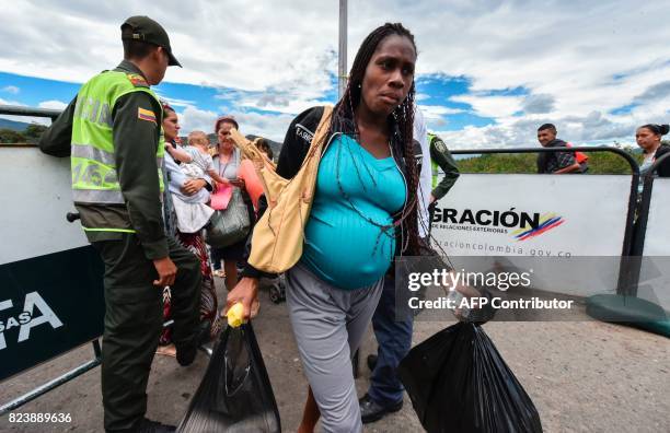 Venezuelan pregnant woman crosses the Simon Bolivar international bridge from San Antonio del Tachira, Venezuela to Cucuta, North of Santander...