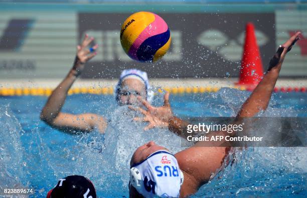 Russian Maria Borisova and Canadian Monika Eggens fight for the ball in 'Hajos Alfred' swimming pool in Budapest on July 28, 2017 during the women...