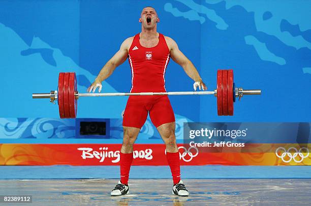 Szymon Kolecki of Poland celebrates after a successful lift in the men's 94kg weightlifting event held at the Beijing University of Aeronautics &...