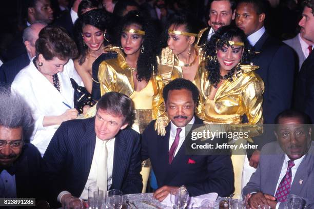 Boxing Promoter Don King Businessman Donald Trump and The Reverend Jesse Jackson with unknown singers from hotel lounge act at Tyson vs Holmes pre...