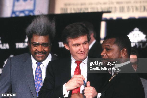 Businessman Donald Trump Boxing Promoter Don King and Promoter Butch Lewis at Tyson vs Holmes press conference at Trump Plaza Casino Hotel in...