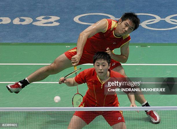 He Hanbin and partner Yu Yang of China play against Flandy Limpele and Vita Marissa of Indonesia in the mixed doubles bronze medal play-off badminton...