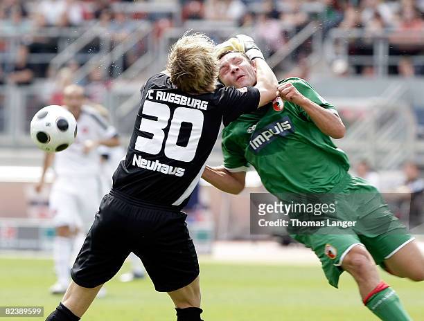 Ingo Hertsch and Sven Neuhaus of Augsburg collide during the 2nd Bundesliga match between 1. FC Nuernberg and FC Augsburg on August 17, 2008 at the...