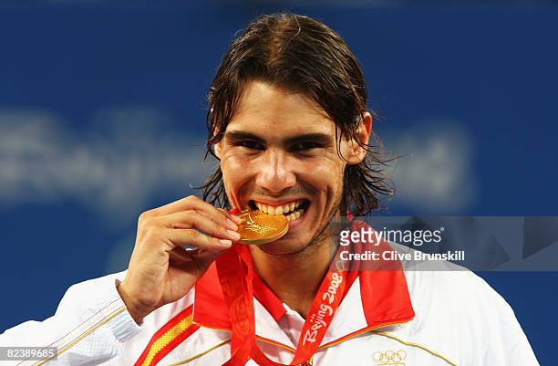 Rafael Nadal of Spain celebrates winning the gold medal against Fernando Gonzalez of Chile during the men's singles gold medal tennis match held at...