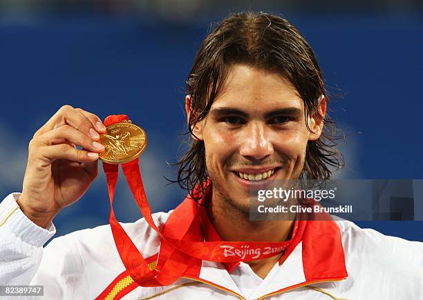 Rafael Nadal of Spain celebrates winning the gold medal against Fernando Gonzalez of Chile during the men's singles gold medal tennis match held at...