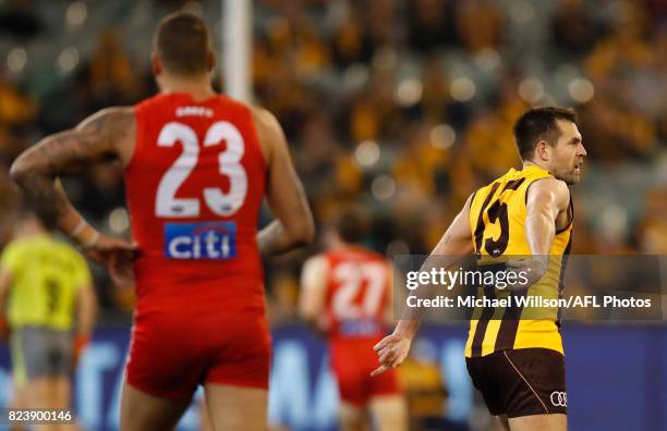 Luke Hodge of the Hawks points to Lance Franklin of the Swans during the 2017 AFL round 19 match between the Hawthorn Hawks and the Sydney Swans at...