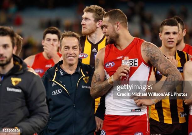 Alastair Clarkson, Senior Coach of the Hawks and Lance Franklin of the Swans chat during the 2017 AFL round 19 match between the Hawthorn Hawks and...