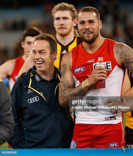 Alastair Clarkson, Senior Coach of the Hawks and Lance Franklin of the Swans chat during the 2017 AFL round 19 match between the Hawthorn Hawks and...