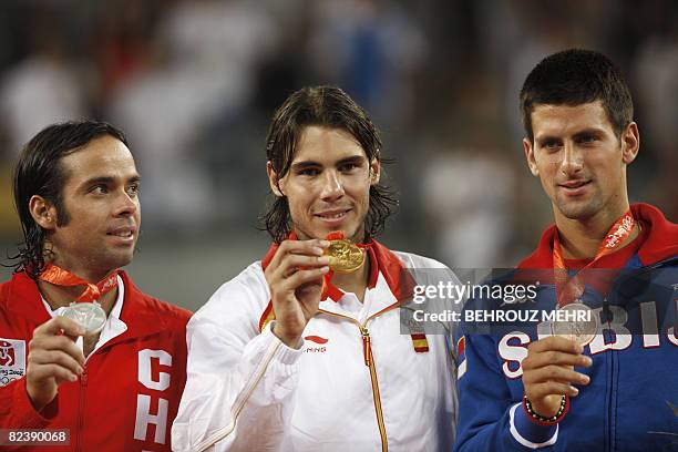 Gold medallist Rafael Nadal of Spain poses with silver medallist Fernando Gonzalez of Chile and bronze medallist Noval Djokovic of Serbia on the...