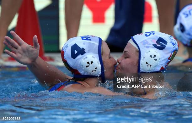 Russia's Elvina Karimova and Maria Borisova celebrate their victory over Canada in 'Hajos Alfred' swimming pool of Budapest on July 28, 2017 after...