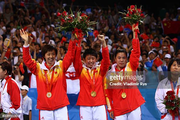 Guo Yue, Wang Nan and Zhang Yining of China pose after winning the gold medal in the Women's Team Gold Medal Contest table tennis event held at the...