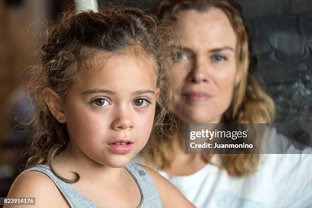 mother and daughter - family serious stock pictures, royalty-free photos & images