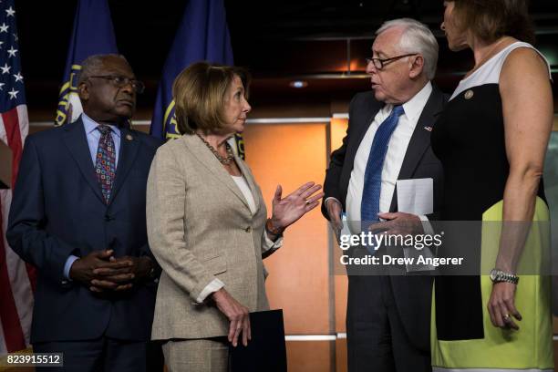 Rep. James Clyburn looks on as House Minority Leader Nancy Pelosi speaks to Rep. Steny Hoyer during a press conference regarding the Senate's defeat...
