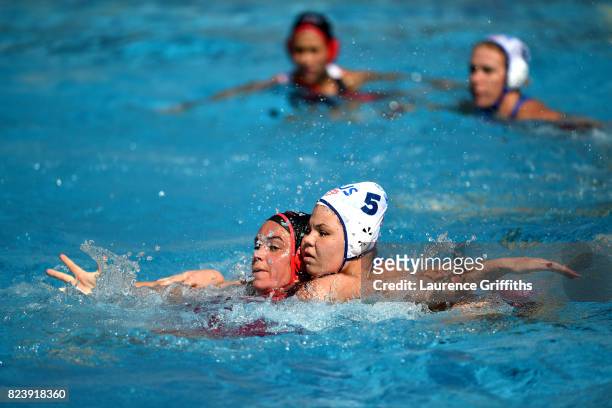 Christine Robinson of Canada and Maria Borisova of Russia in action during the Women's Waterpolo Bonze Medal match between Russia and Canada on day...