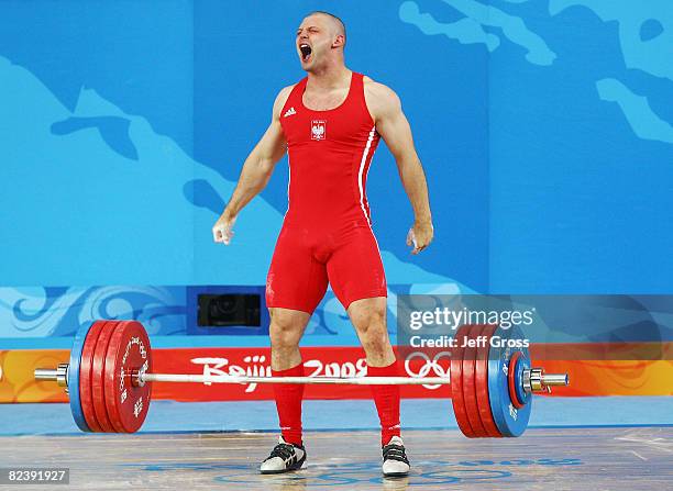 Szymon Kolecki of Poland celebrates a successful lift in the men's 94kg weightlifting event held at the Beijing University of Aeronautics &...