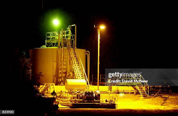 Storage tanks are illuminated at the Aera Ventura Oil Production Operation, February 15 in the Ventura Oil Field near Ventura, CA. In recent months...